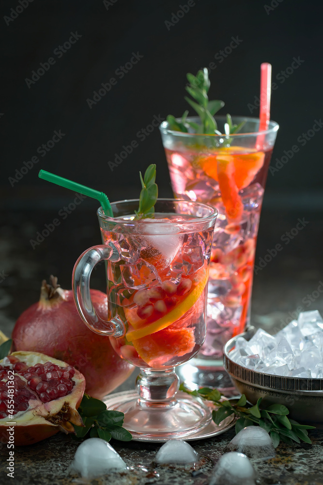 Fototapeta premium Fruit cocktail, in a glass with natural healthy fruits on a table with kitchen accessories.
