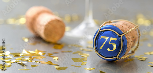Champagne cap with the Number 75 photo