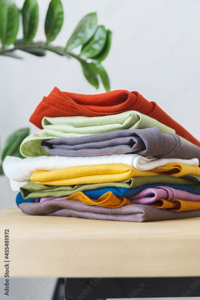 textured multi-colored linen fabric - blue, red, yellow, brown lying on the table on top of each other