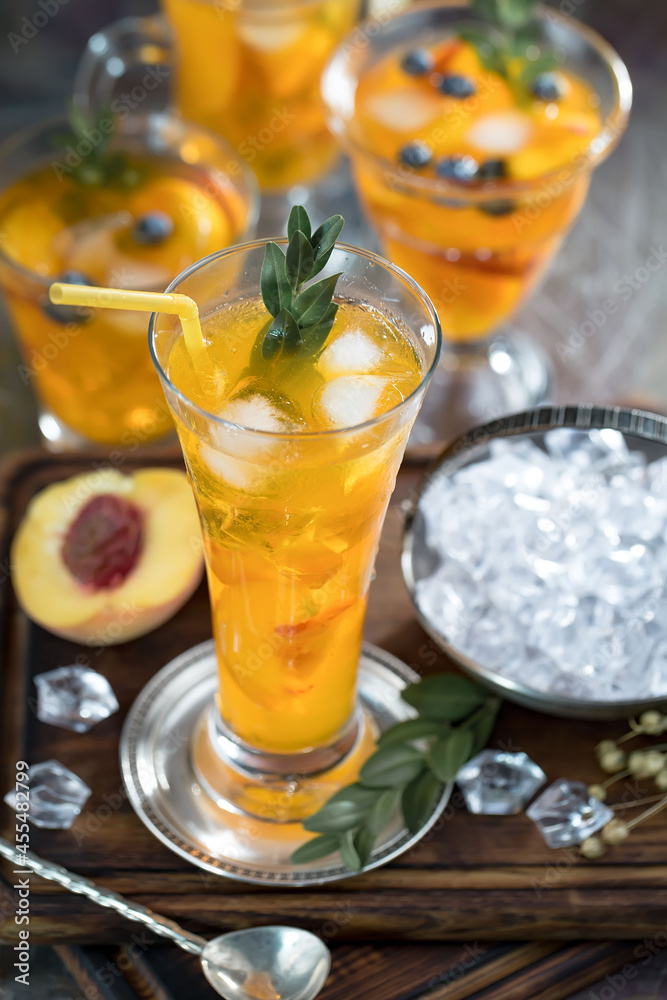 Fruit cocktail, in a glass with natural healthy fruits on a table with kitchen accessories. Fruit cocktail, in a glass with natural healthy fruits on a table with kitchen accessories.