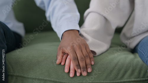 Loving African Man Putting Hand over Caucasian Woman s Hand