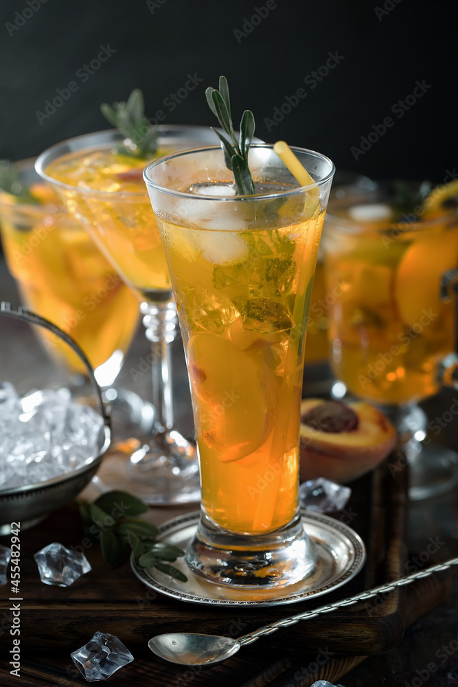 Fruit cocktail, in a glass with natural healthy fruits on a table with kitchen accessories.