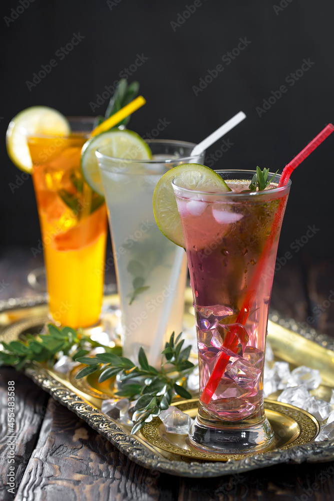Fototapeta premium Refreshing summer alcoholic cocktail with crushed ice and citrus fruits