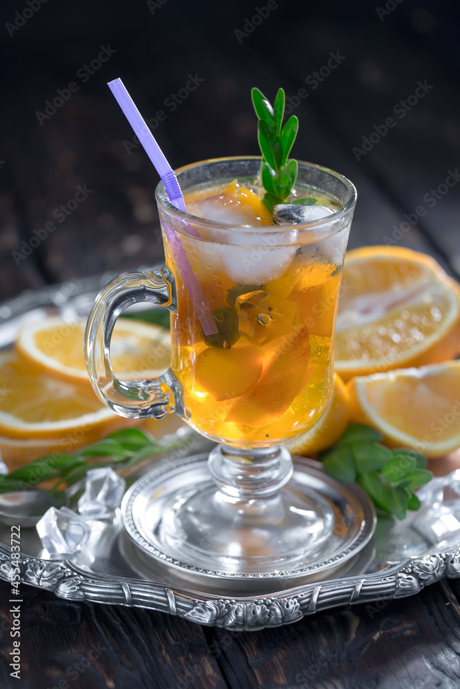 Fruit cocktail, in a glass with natural healthy fruits on a table with kitchen accessories. Fruit cocktail, in a glass with natural healthy fruits on a table with kitchen accessories.