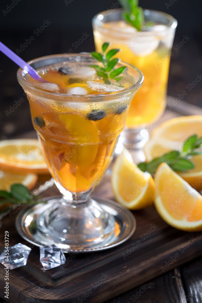 Fruit cocktail, in a glass with natural healthy fruits on a table with kitchen accessories. Fruit cocktail, in a glass with natural healthy fruits on a table with kitchen accessories.