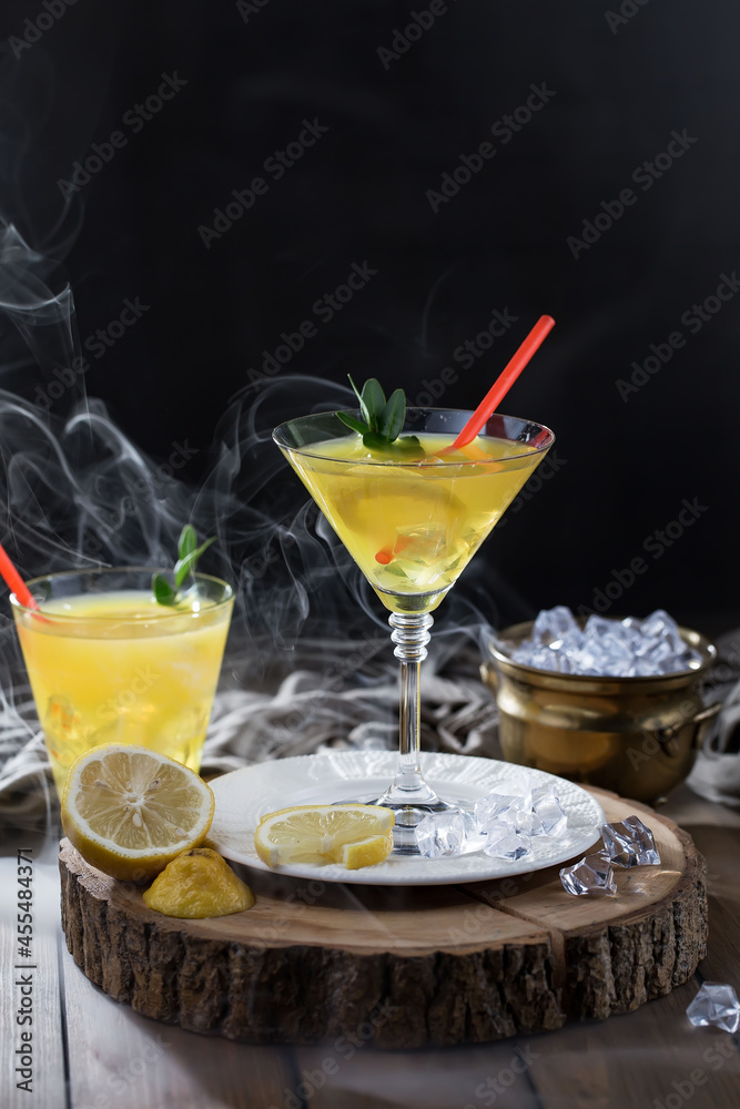 Fototapeta premium Refreshing summer alcoholic cocktail with crushed ice and citrus fruits