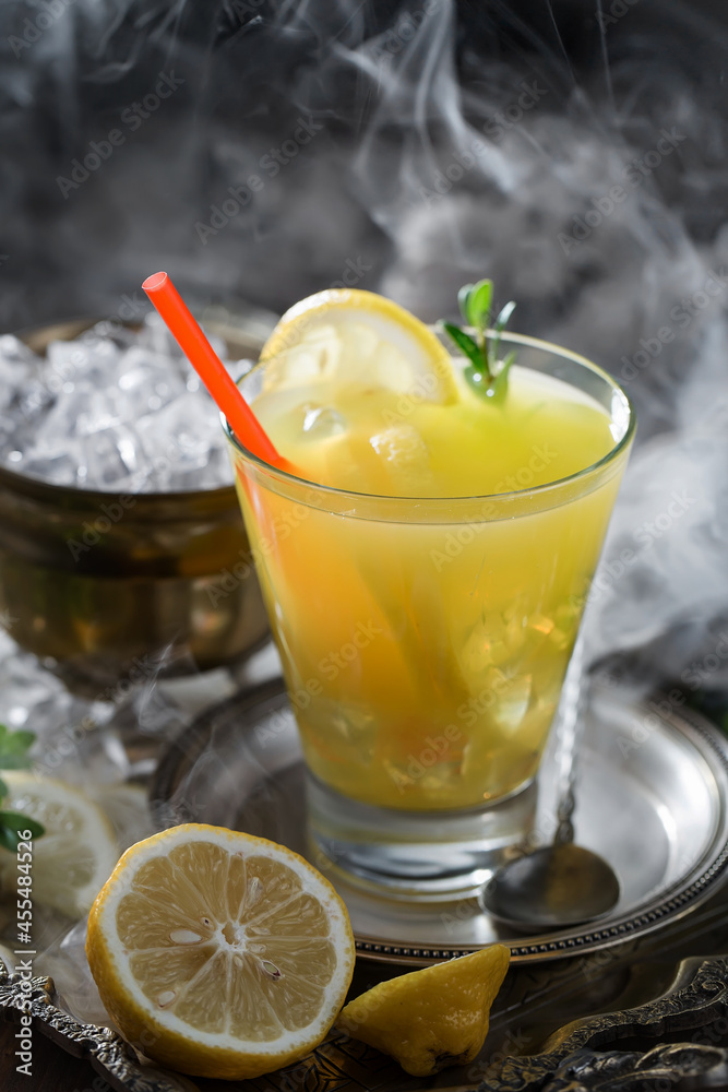Fototapeta premium Refreshing summer alcoholic cocktail with crushed ice and citrus fruits