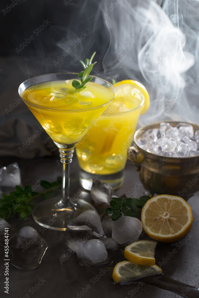 Fototapeta premium Fruit cocktail, in a glass with natural healthy fruits on a table with kitchen accessories.