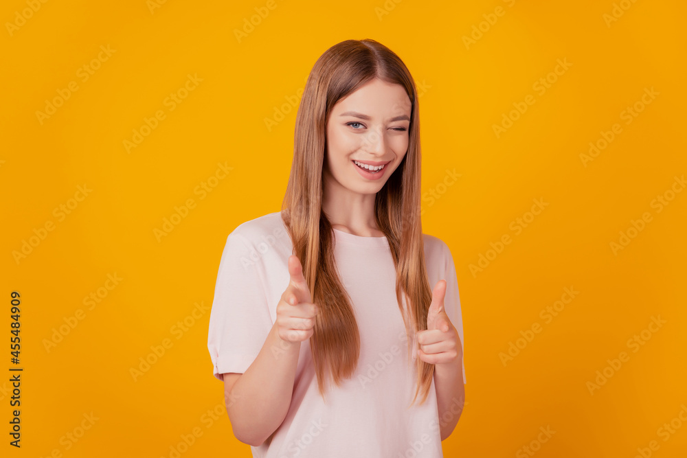 Portrait of gorgeous charming girlfriend fingers gesturing camera on yellow background Portrait of gorgeous charming girlfriend fingers gesturing camera on yellow background