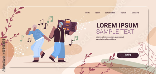 senior family with bass clipping blaster recorder dancing and singing africna american grandparents having fun