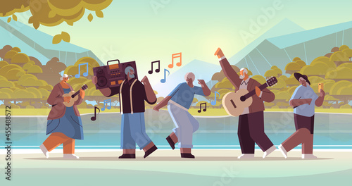 mix race senior people with bass clipping blaster recorder dancing and singing grandparents having fun active old age