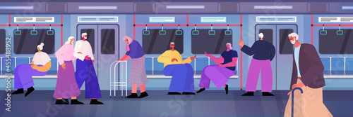 senior passengers with stick and orthopedic walker moving in subway underground old age concept
