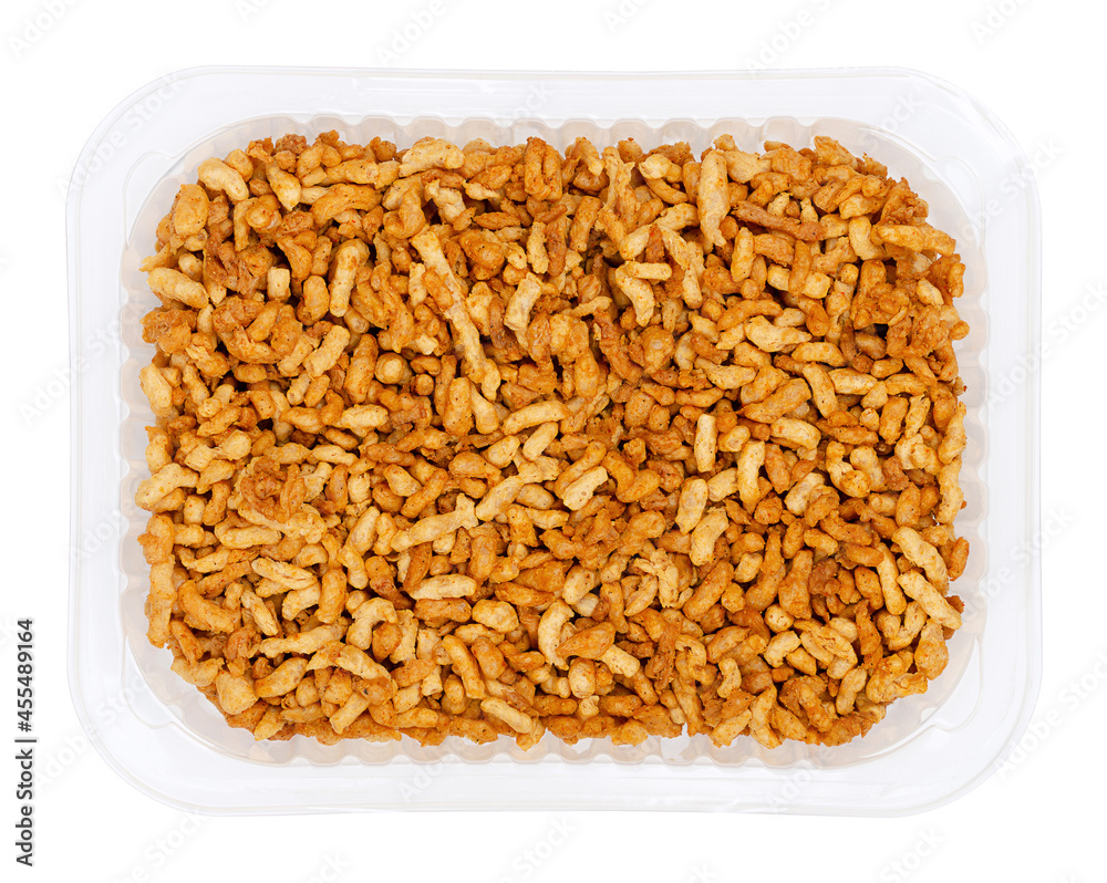 Vegan minced meat, in a clear plastic tray. Substitute and alternative for ground meat, based on seasoned pea protein, passed through a spiral screw mincer. Close-up from above over white, food photo. Vegan minced meat, in a clear plastic tray. Substitute and alternative for ground meat, based on seasoned pea protein, passed through a spiral screw mincer. Close-up from above over white, food photo.