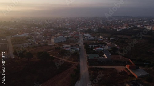 Aerial view going up at dawn of the town of Casasimaro in Cuenca Spain