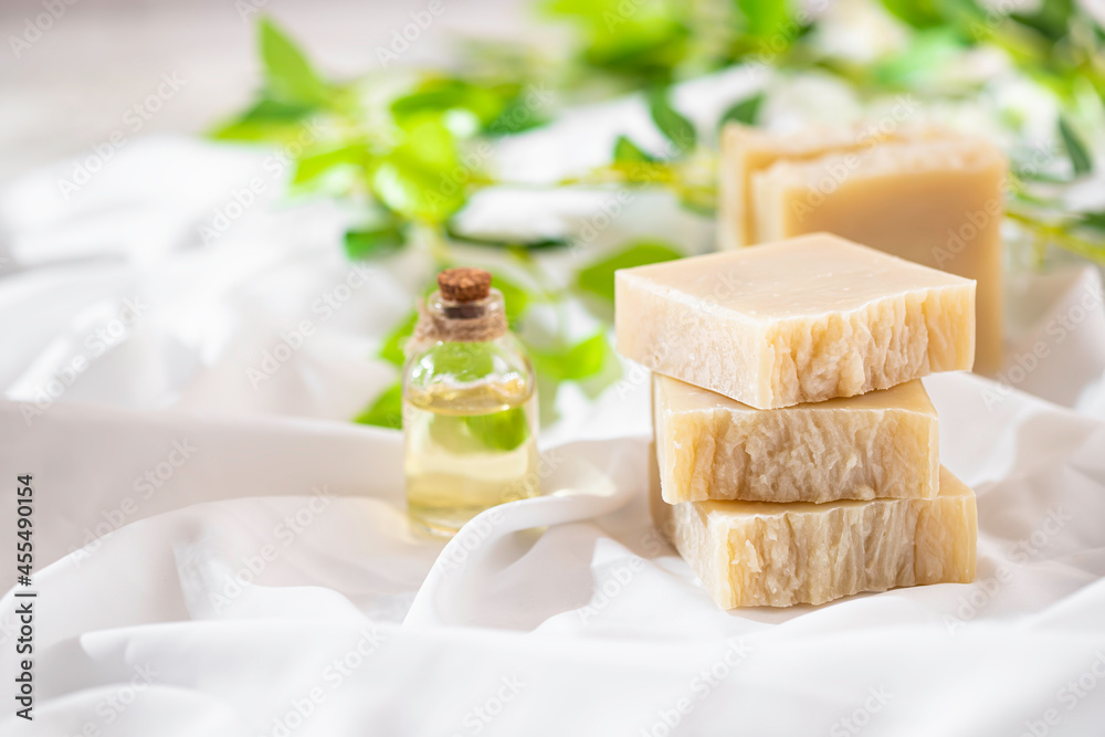 Natural handmade soap on white silk. Aromatic natural soap. Organic soap.