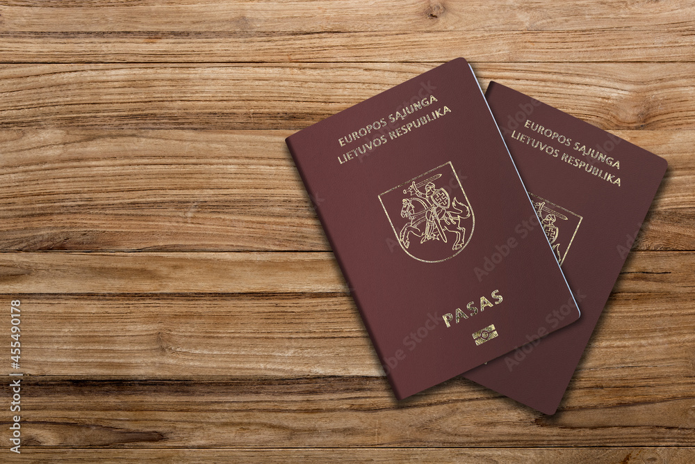 Lithuanian Passport on Wood Lines Background Banner with Copy Space Lithuanian Passport on Wood Lines Background Banner with Copy Space