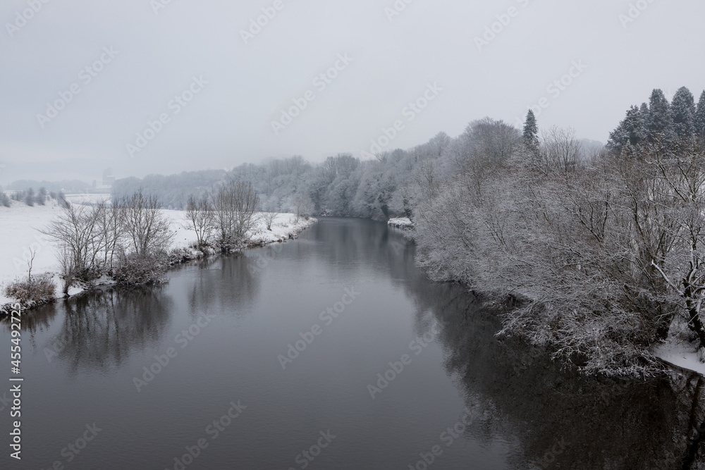 Winter scenic landscape in the ribble valley, lancashire. Snowy trees along the river ribble, clitheroe Winter scenic landscape in the ribble valley, lancashire. Snowy trees along the river ribble, clitheroe