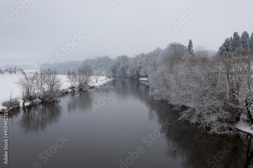 Winter scenic landscape in the ribble valley, lancashire. Snowy trees along the river ribble, clitheroe