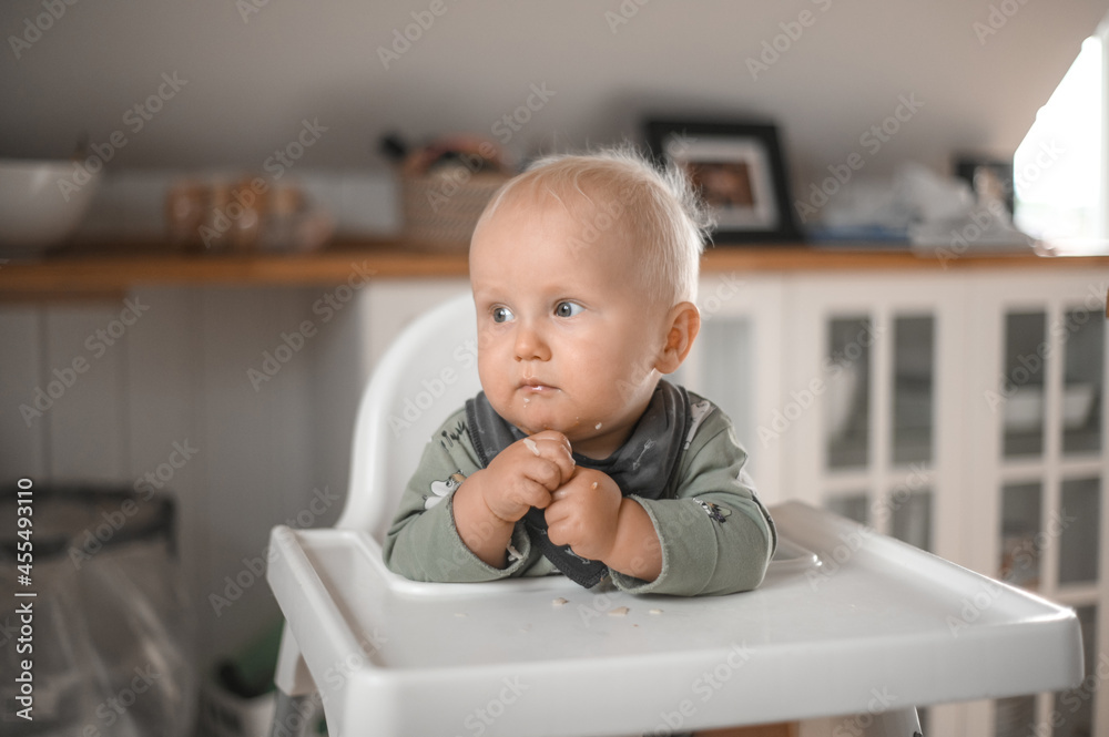 close up portrait of cute boy smiling eating baby food. Happy childhood close up portrait of cute boy smiling eating baby food. Happy childhood
