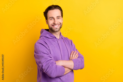 Profile side photo of young man happy positive smile folded hands confident isolated over yellow color background