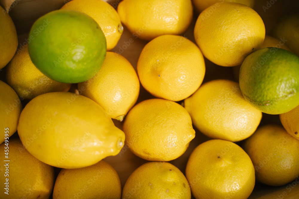 Juicy lemons on the counter in the supermarket. Close-up. Healthy eating and vegetarianism. Space for text. Background. Juicy lemons on the counter in the supermarket. Close-up. Healthy eating and vegetarianism. Space for text. Background.