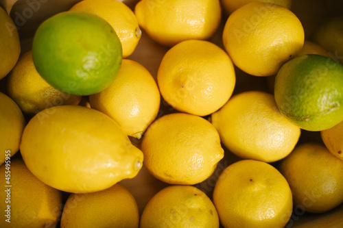 Juicy lemons on the counter in the supermarket. Close-up. Healthy eating and vegetarianism. Space for text. Background.