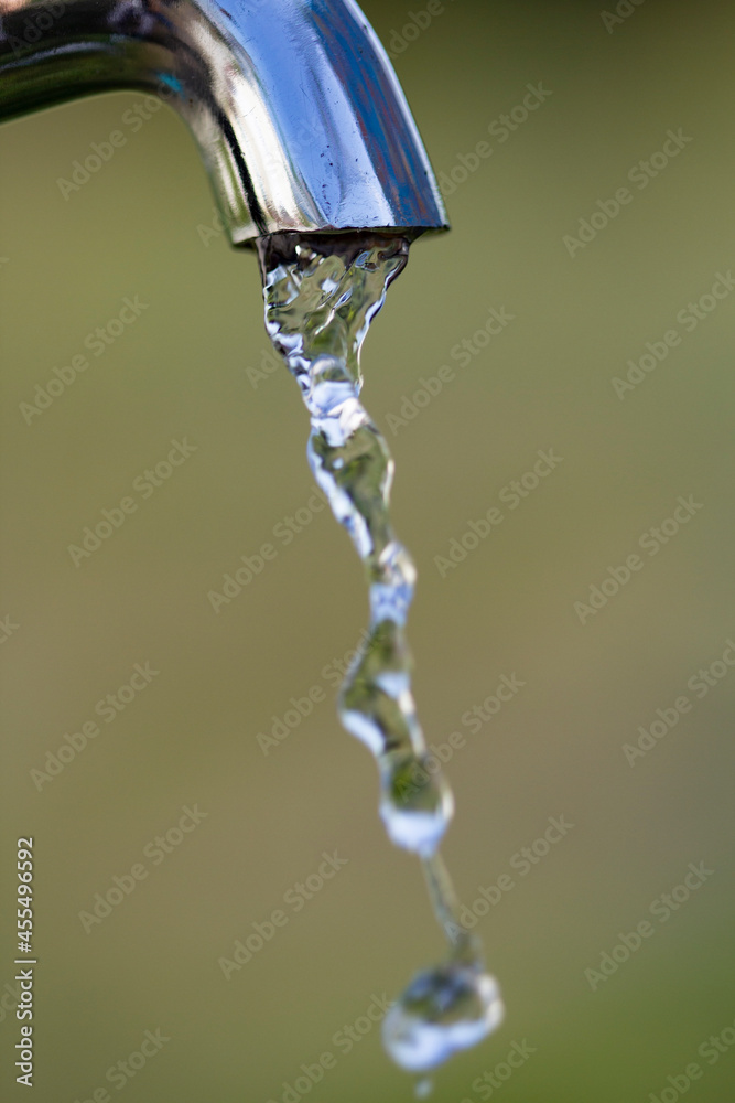 Metal tap with drain water outdoors Metal tap with drain water outdoors
