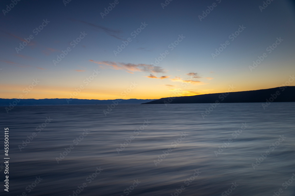 Mystical sunrise over the sea. Scenic ferry ride in the morning. Beautiful Croatia. 