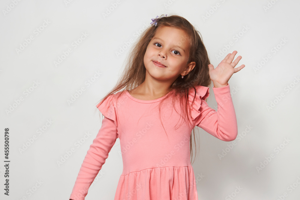 Portrait of cute happy child girl against white background
