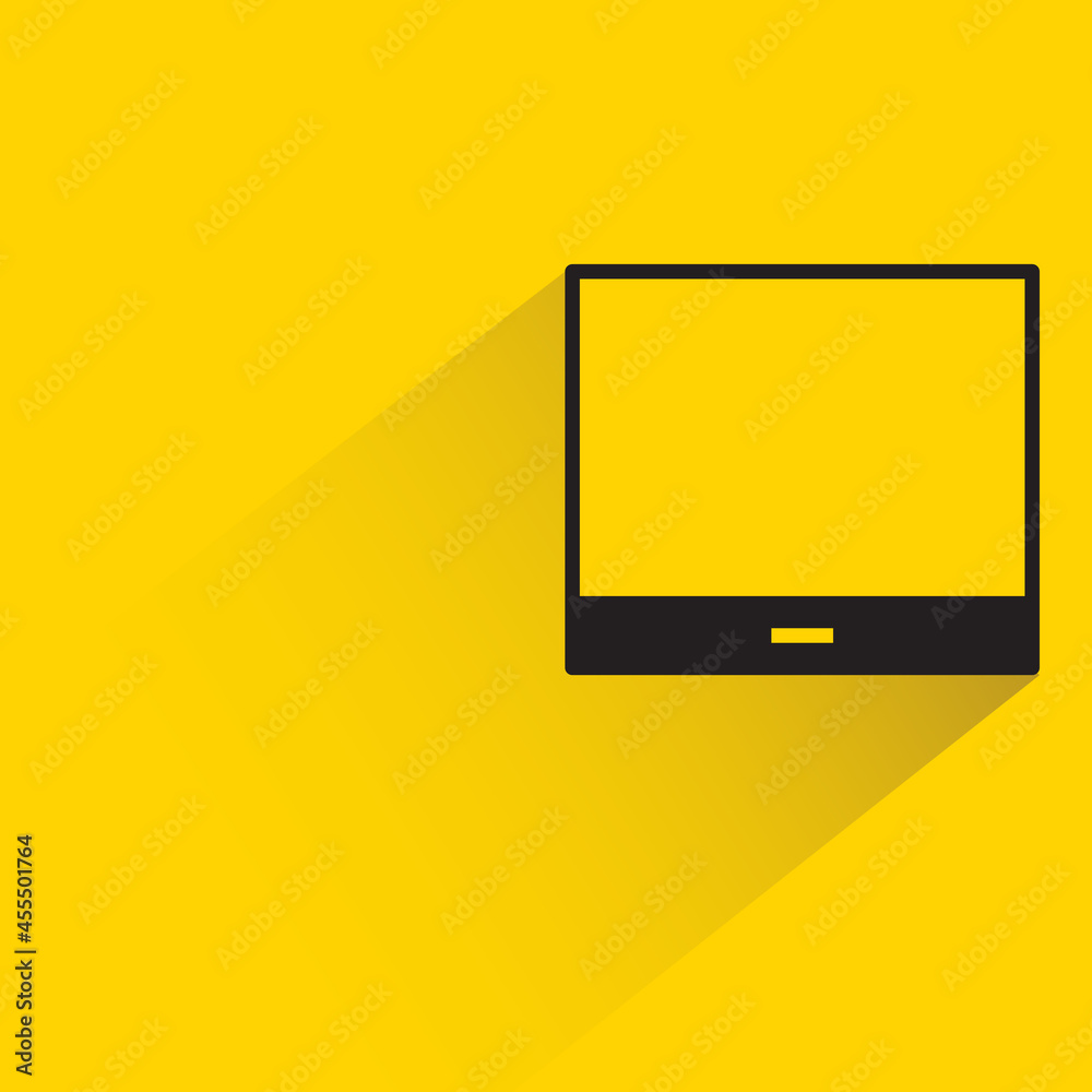 computer screen with shadow on yellow background