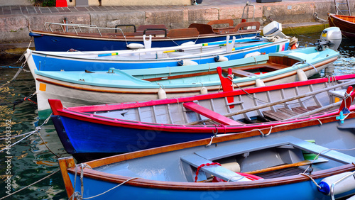 characteristic wooden boats in Limone sul Garda Italy © maudanros