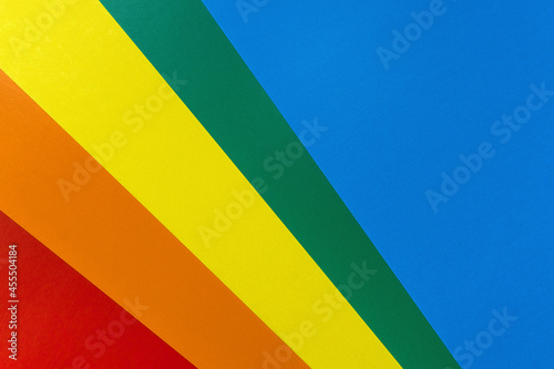 folded sheets of cardboard paper in vivid colors. Bright abstract background