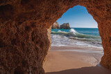 Beautiful ocean landscape, the coast of the Atlantic Ocean, Portugal, the Algarve. Blue ocean, cloudless sky, yellow rocks