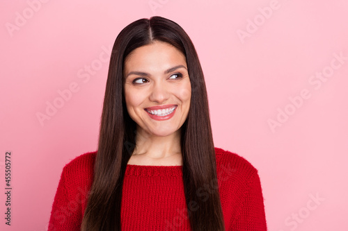 Photo of thoughtful nostalgic girl look empty space shiny smile wear red pullover isolated pink color background © deagreez