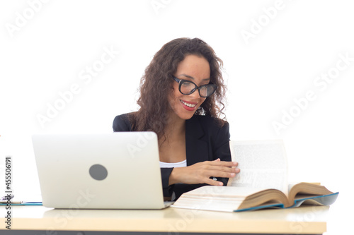 Happy excited successful Beautiful hispanic businesswoman triumphing in modern office with laptop, success happy pose. Work from home