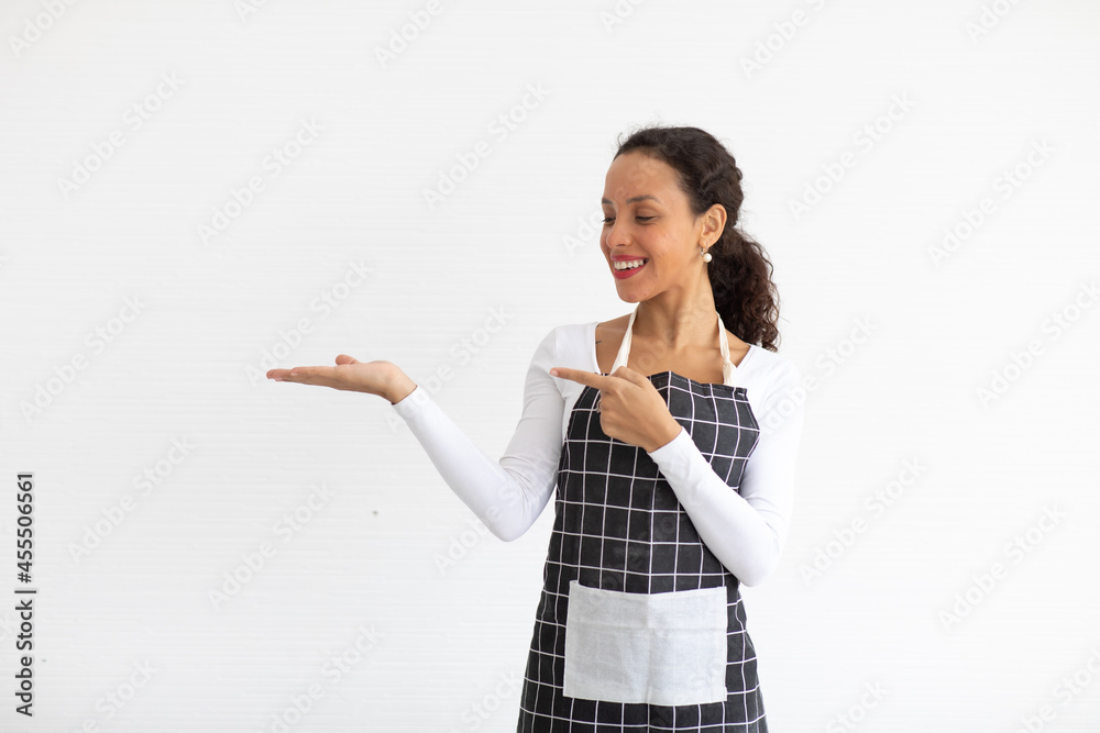 Portrait of smiling young woman in apron looking at camera isolated on white background Portrait of smiling young woman in apron looking at camera isolated on white background