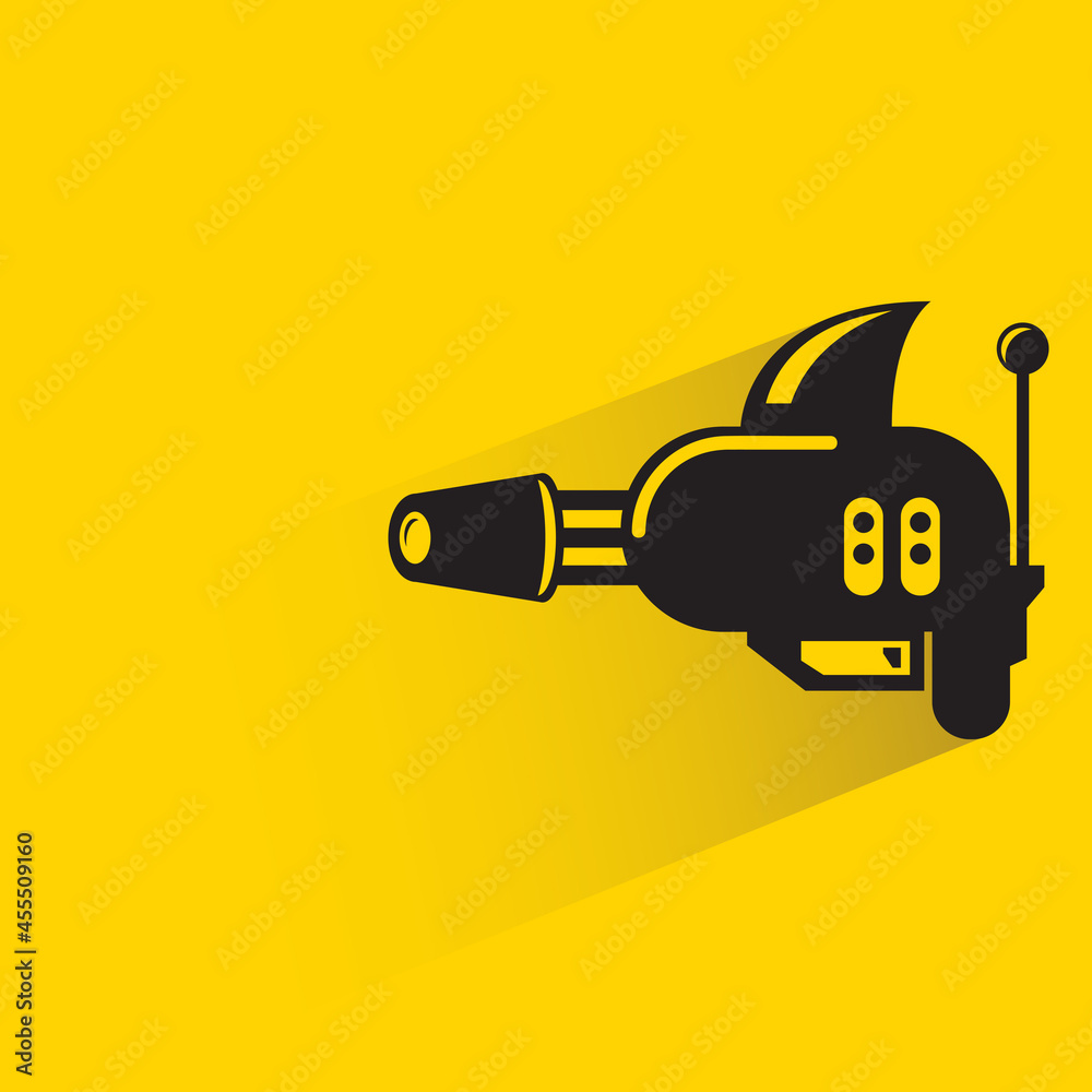 space gun with shadow on yellow background space gun with shadow on yellow background
