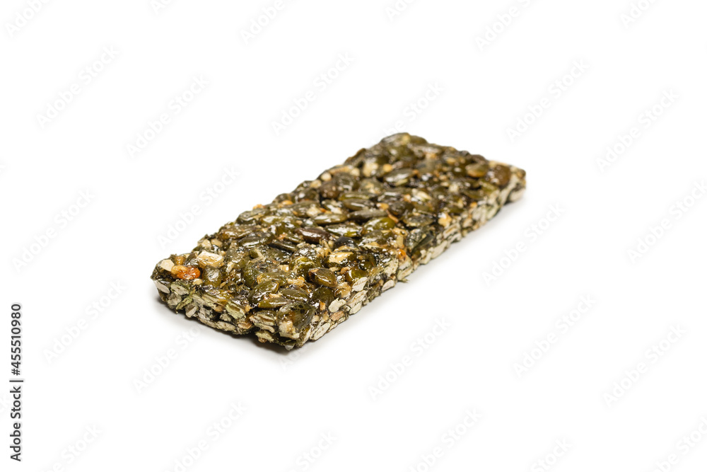 Bar with nuts isolated on a white background. Pumpkin seeds bar. Bar with nuts isolated on a white background. Pumpkin seeds bar.