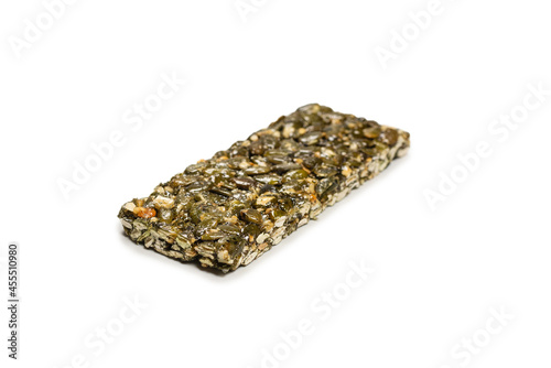 Bar with nuts isolated on a white background. Pumpkin seeds bar.