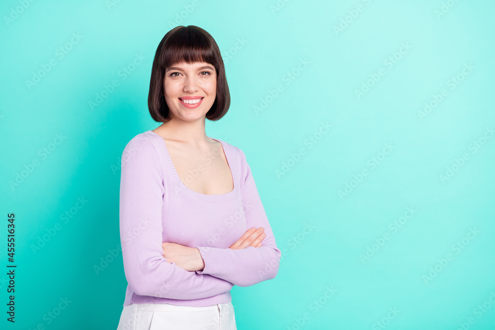 Photo portrait business woman folded hands smiling isolated bright teal color background copyspace Photo portrait business woman folded hands smiling isolated bright teal color background copyspace