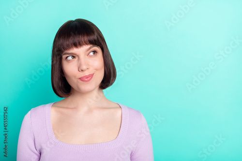 Photo portrait pretty woman curious looking copyspace dreamy thoughtful isolated vivid turquoise color background