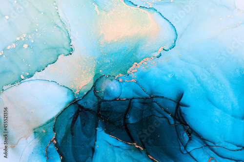 Luxury abstract background in alcohol ink technique, indigo blue gold liquid painting, scattered acrylic blobs and swirling stains, printed materials © amixstudio