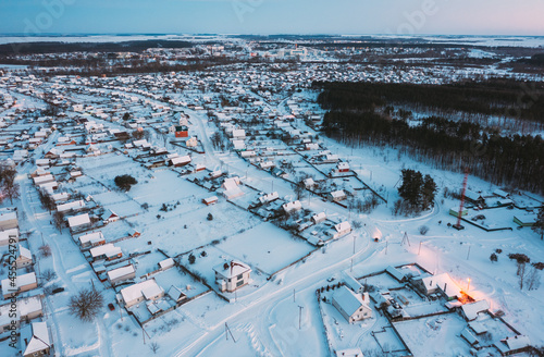 Aerial View Of Town Skyline Winter Evening Night. Snowy Landscape Cityscape Skyline photo