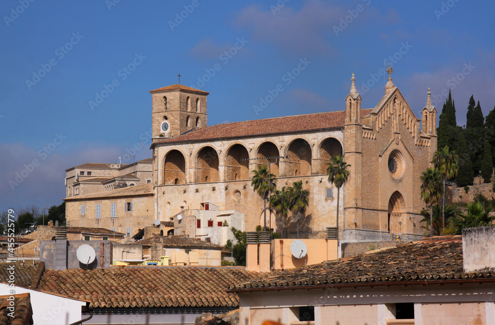 Medieval Church of the Transfiguration of the Lord and tiled roofs in the old town of Artà, Mallorca Island in Spain