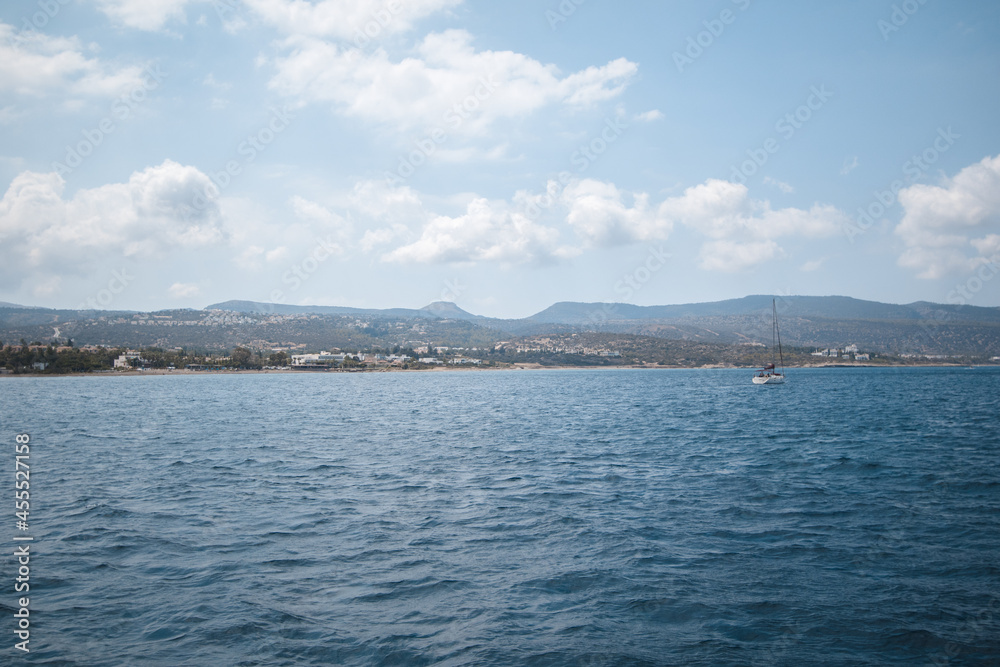 Natural landscape with mountains, sea, blue sky and clouds near Cyprus