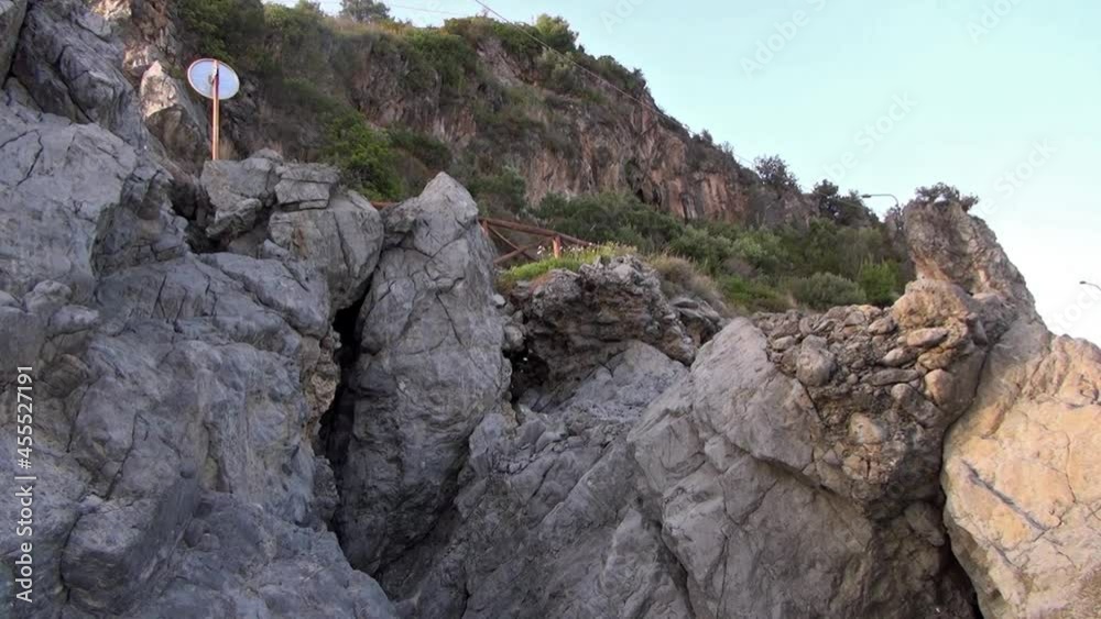 Mountain road along the promenade and rocks on the slope below. Mountain road along the promenade and rocks on the slope below.