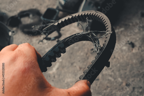 Inspecting or inspecting damaged belts  motorcycle engines.