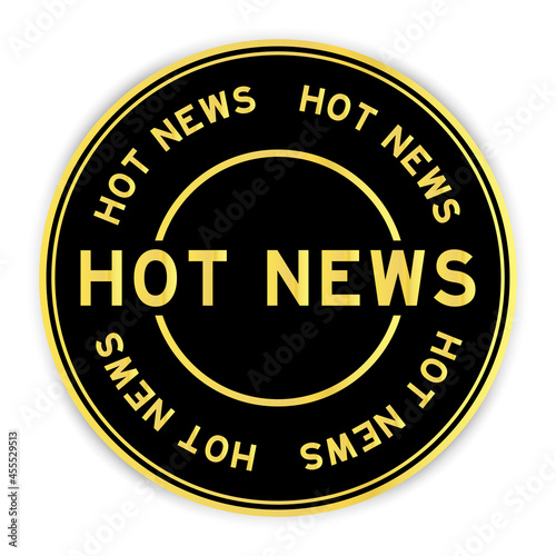 Black and gold color round label sticker with word hot news on white background
