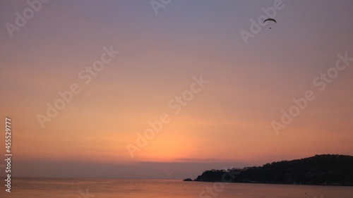 Paraglider on the background of sunset