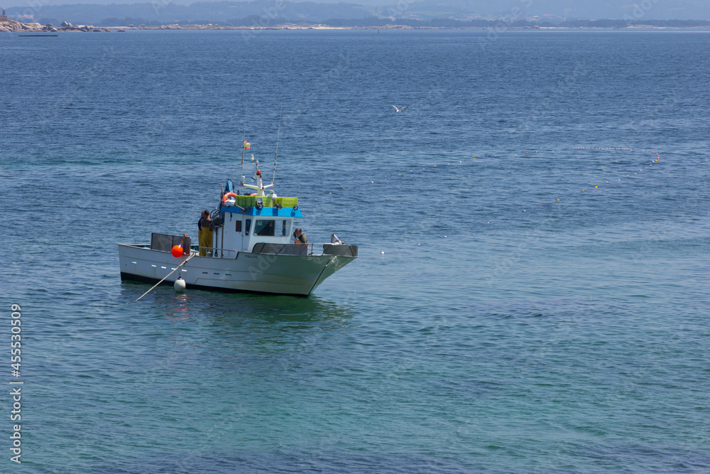 Fishing boat, fishing near the shore